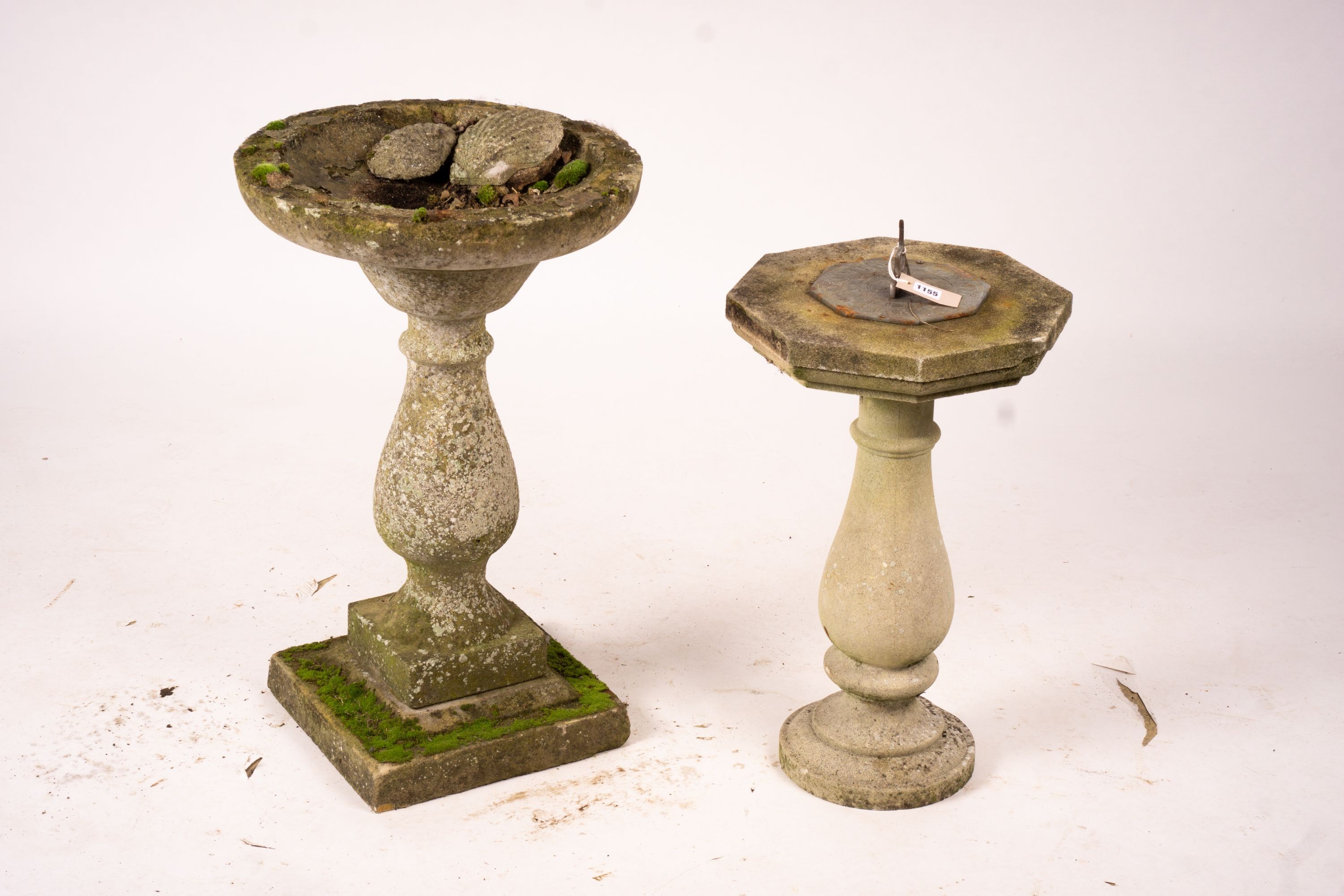 A reconstituted stone baluster pillar sundial and bird bath, tallest 72cm